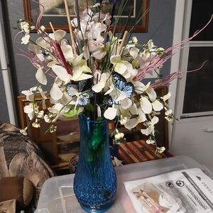 Elegant Blue Vase with White Floral Arrangement